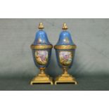 A good pair of French 19th century Sevres urns with hand painted panels of the courting scenes.