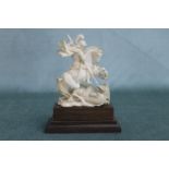 A good early carved ivory figure depicting St. George slaying the dragon on pedestal base. Height