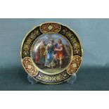 A Royal Vienna hand painted plate with fine gilded border, titled 'Paris and Helena'. Diameter 24cm