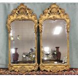 A good pair of English George III style pier glasses with carved decoration. Height 101cm, Width