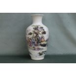 A Chinese hand painted porcelain vase having figure in landscape decoration. Height 43cm, Width