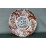 A fine Japanese 19th century Imari charger with phoenix decoration. Diameter 46cm