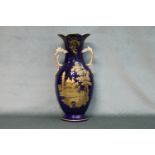 A fine large 19th century two handled Paris porcelain vase with raised gilt figure in landscape