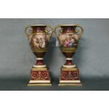 A good pair of 19th century Royal Vienna vases on pedestal bases with classical maiden decoration.