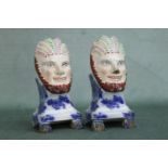 A pair of early Staffordshire book ends with mask decoration. Height 16cm, Width 8cm