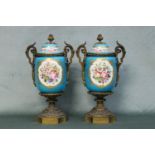 A fine pair of French 19th century Sevres lidded vases having fine ormolu mounts, hand painted