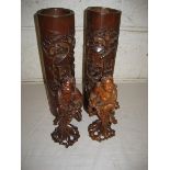 Pair of 20th Century bamboo vases decorated in relief 33 cm high and 2 figures (4)