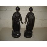 Pair of 19th Century carved wooden figures one holding chisel the other an easel on bases 62 cm