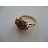 18 Carat Gold Diamond and Ruby Ring with 4 central rubies surrounded by 16 diamonds (4 g)