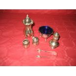 A silver condiment pot, a silver salt with blue liner etc (the contents of 1 bag)