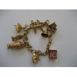 9 Carat Gold Charm Bracelet with collection of charms (25 g)