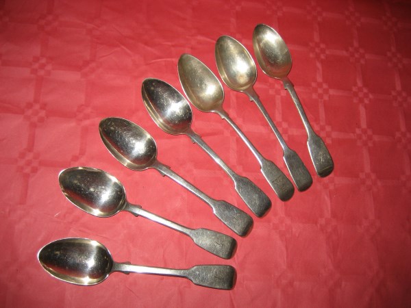 Seven matched silver table spoons