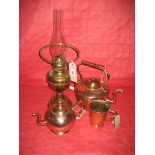 A late 19th Century copper kettle, a brass oil lamp etc (4)