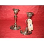 A pair of 19th Century silver plate candlesticks 21 cm high