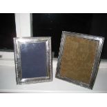 A silver photograph frame together with another (2).