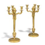 A PAIR OF ROYAL LOUIS-PHILIPPE ORMOLU FOUR-LIGHT CANDELABRA
CIRCA 1810
Each with a flambeau finial