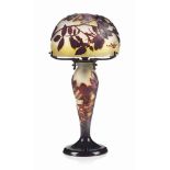 A GALLE CAMEO GLASS TABLE LAMP
CIRCA 1910
The yellow and white body overlaid in brown and acid-