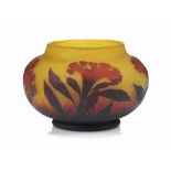 A DAUM CAMEO GLASS VASE
CIRCA 1910
The mottled amber glass overlaid and acid-etched with flowers and