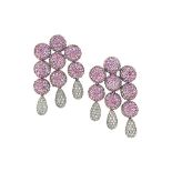 A pair of pink sapphire and diamond earrings
Of pavé pink sapphire boule triple drop design with