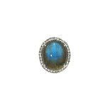 An 18ct white gold, labradorite and diamond ring
The oval cabochon labradorite within a brilliant-