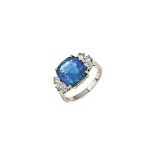 A sapphire and diamond ring
The cushion shaped sapphire, weighing approximately 7.03 carats, to pear