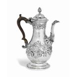 A GEORGE III SILVER COFFEE POT
MARK OF CHARLES WRIGHT, LONDON, 1776
Baluster form chased with rococo