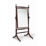 A REGENCY PURPLEWOOD-INLAID MAHOGANY CHEVAL MIRROR
EARLY 19TH CENTURY
The mirror frame edged in
