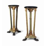 A PAIR OF REGENCY STYLE GREEN-PAINTED AND PARCEL-GILT TORCHERES
LATE 19TH / EARLY 20TH CENTURY