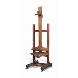 A LATE VICTORIAN OAK ARTIST'S EASEL
LATE 19TH CENTURY
On castors, with adjustable picture rests to