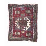 An antique Kazak Karatchopf rug
approx: 6ft.5in. x 4ft.1in.(196cm. x 124cm.)
