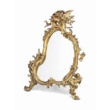 A FRENCH GILT-BRONZE TABLE EASEL-MIRROR
OF LOUIS XV STYLE, LATE 19TH CENTURY
The cast frame