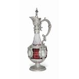 A GERMAN SILVER-MOUNTED GLASS CLARET JUG
CIRCA 1895
With tapering fluted neck , the lower body