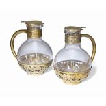 A PAIR OF FRENCH SILVER-GILT MOUNTED GLASS CLARET JUGS
MARK OF THE FIRM OF QUEILLÉ, PARIS, CIRCA