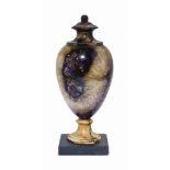 AN ENGLISH DERBYSHIRE BLUE JOHN URN
19TH CENTURY
Of baluster form, on a black marble square base,