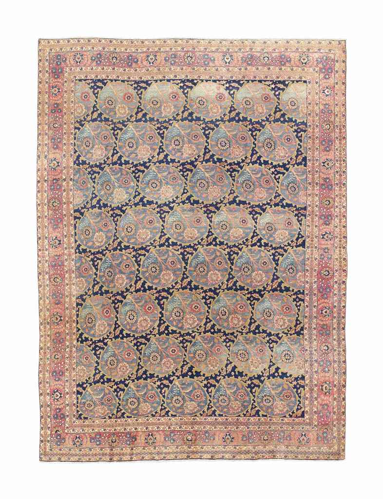A fine Khoy Tabriz carpet
approx: 13ft.10in. x 10ft.6in.(422cm. x 320cm.)