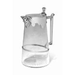 A VICTORIAN SILVER-MOUNTED ETCHED GLASS LEMONADE JUG
MARK OF EDWARD HUTTON, LONDON, 1888
Broad