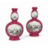 A PAIR OF CHINESE FAMILLE ROSE DOUBLE GOURD VASES
20TH CENTURY
Decorated with shaped panels