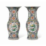 A LARGE PAIR OF CHINESE FAMILLE ROSE ‘DRAGON’ VASES
19TH CENTURY
Decorated with four roundels