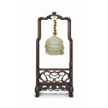 A CHINESE CELADON JADE 'CANOPY' PENDANT
MING DYNASTY (1368-1644)
The jade pendant carved as a