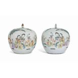 A PAIR OF CHINESE FAMILLE ROSE VASES AND MATCHED COVERS
20TH CENTURY
Each vase decorated with two