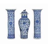 A CHINESE BLUE AND WHITE THREE-PIECE GARNITURE
19TH CENTURY
Comprising two beaker vases and one