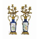 A SIMILAR PAIR OF SMALL CHINESE POWDER BLUE AND GILT-METAL MOUNTED ROULEAU VASES
THE PORCELAIN