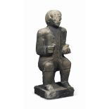 A STONE FIGURE OF A SEATED MAN
POSSIBLY AMERICAN, MID-19TH CENTURY
Clad in coat and waistcoat seated