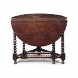 A WILLIAM AND MARY OAK 'CORNER' GATE-LEG TABLE
LATE 17TH CENTURY
With ball-turned legs and