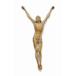 A GERMAN IVORY CRUCIFIX FIGURE
17TH OR 18TH CENTURY
14 in. (36 cm.) high to tips of hands