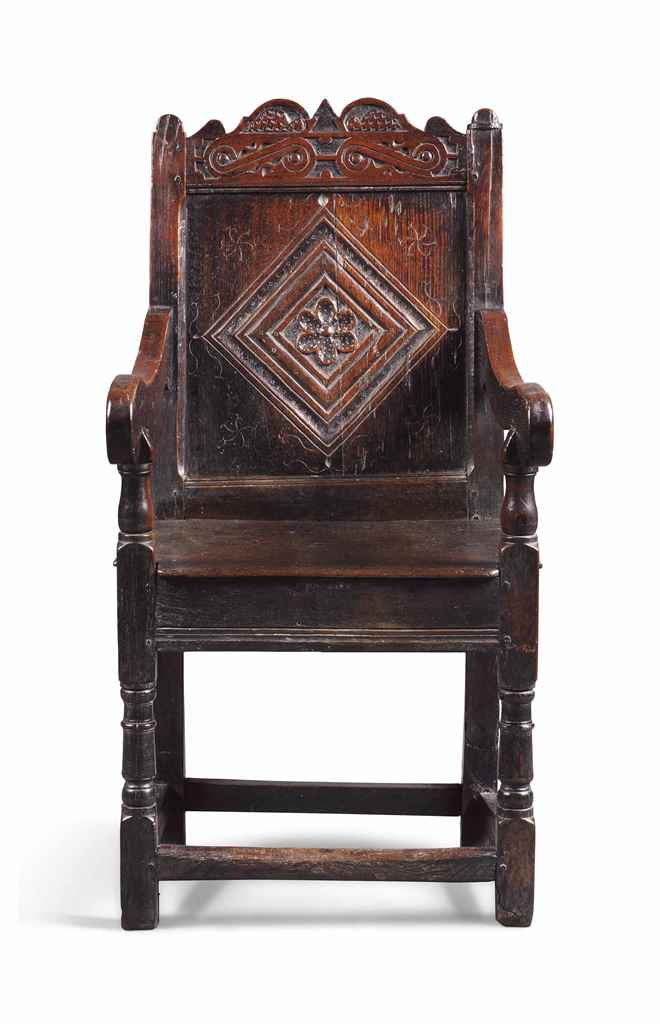 A SMALL WILLIAM AND MARY OAK ARMCHAIR
LATE 17TH CENTURY, PROBABLY WELSH
The scroll crest centred