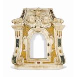 AN ITALIAN WHITE MARBLE TABERNACLE FRAME
LATE 17TH CENTURY
Inset with siena and green marble and