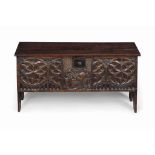AN ELM PLANK CHEST
LATE 18TH CENTURY
The front panel carved later in Medieval style with gothic
