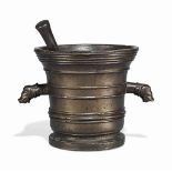 AN ITALIAN BRONZE MORTAR
17TH CENTURY
Cast with bands of raised girdles and grotesque side handles
9