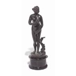 A BRONZE FIGURE OF THE VENUS DE MEDICI
ITALIAN OR FLEMISH, 18TH CENTURY
Standing next to a dolphin